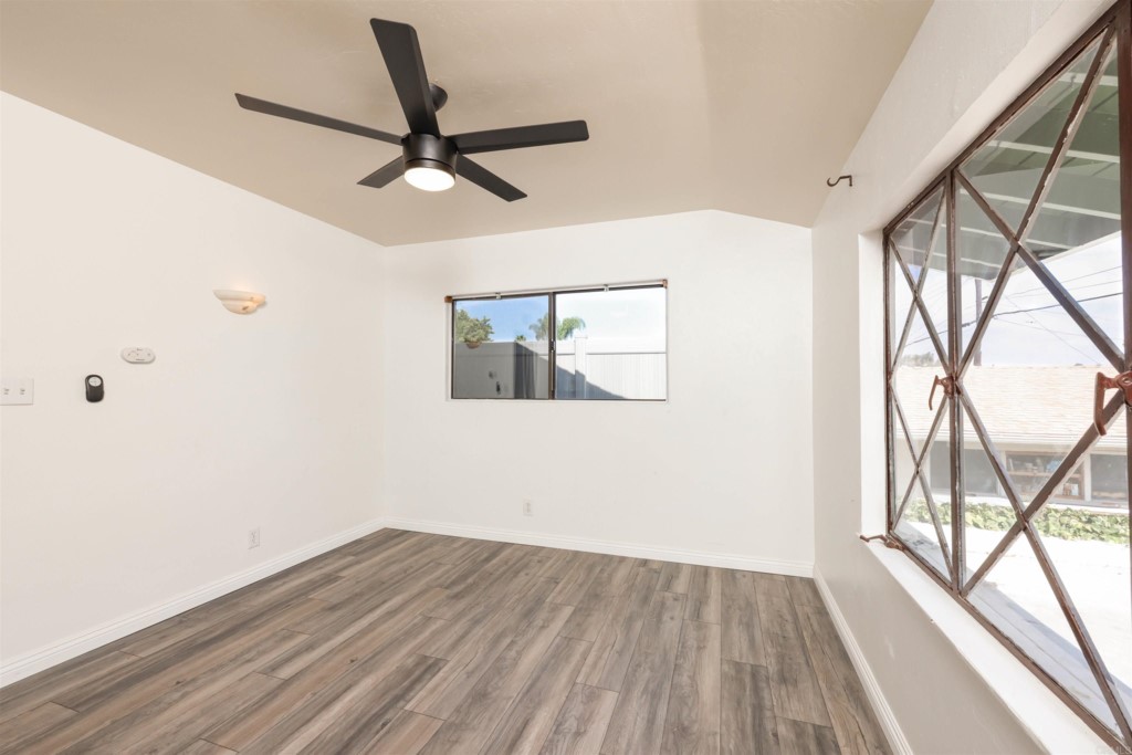 2513 Sarbonne Drive Oceanside, CA 92054 - Photo 34 of 55 a view of empty room with wooden floor and fan
