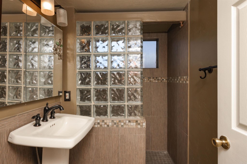 2513 Sarbonne Drive Oceanside, CA 92054 - Photo 36 of 55 a bathroom with a sink and a mirror