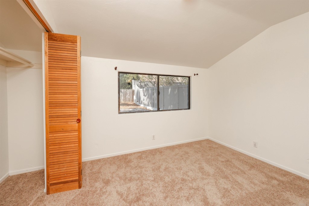 2513 Sarbonne Drive Oceanside, CA 92054 - Photo 37 of 55 a view of an empty room with a window