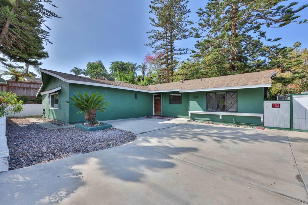 2513 Sarbonne Drive Oceanside, CA 92054 - Photo 4 of 55 a view of a house with a yard and garage