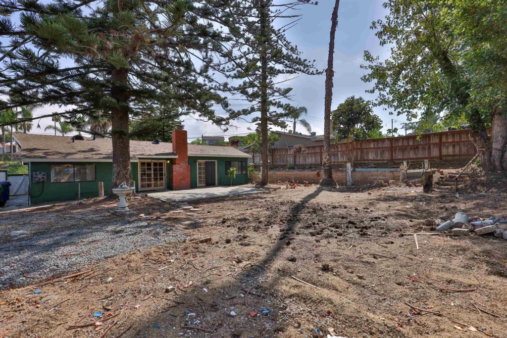 2513 Sarbonne Drive Oceanside, CA 92054 - Photo 44 of 55 a view of a yard with plants and large trees