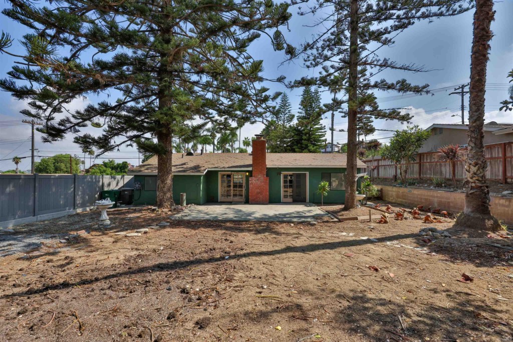 2513 Sarbonne Drive Oceanside, CA 92054 - Photo 50 of 55 a tree in front of a white house