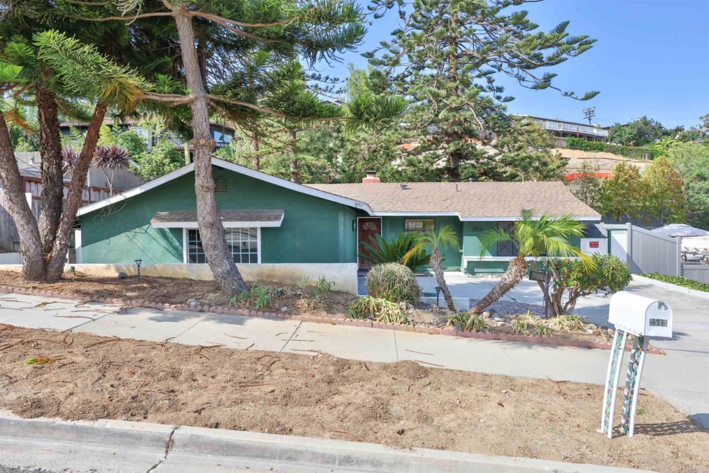2513 Sarbonne Drive Oceanside, CA 92054 - Photo 5 of 55 a front view of a house with garden
