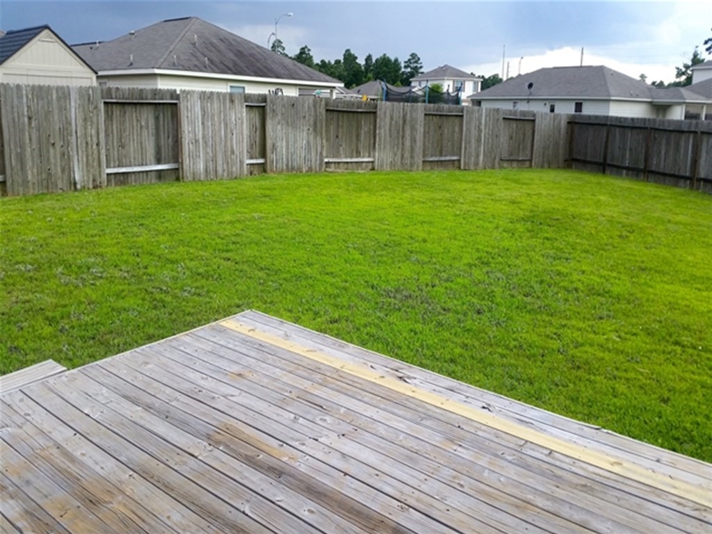 4345 Medina River Loop Spring, TX 77386 - Photo 13 of 14 a view of a house with a backyard