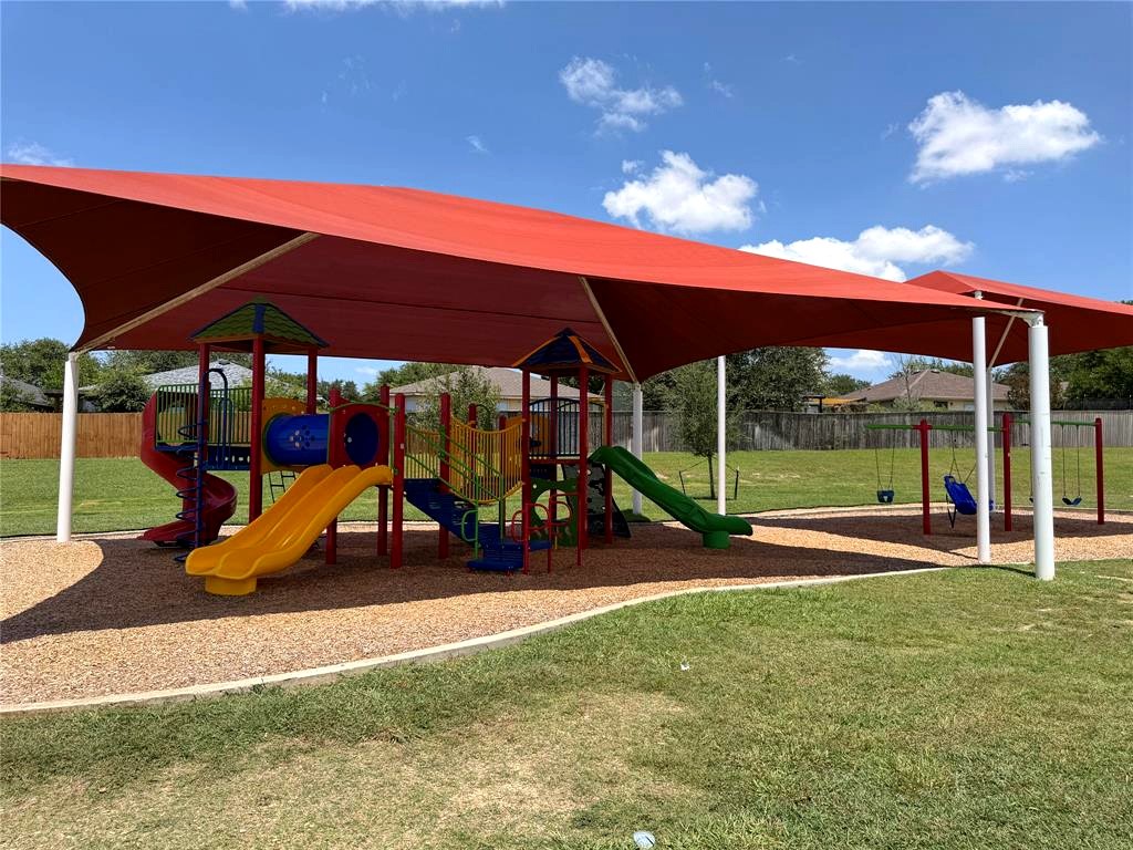 225 Vestral Road Buda, TX 78610 - Photo 22 of 24 Happy kids, tired kids and parents who get 15 quiet minutes are all the wins. This playground features a specialized swing designed for children with disabilities.
