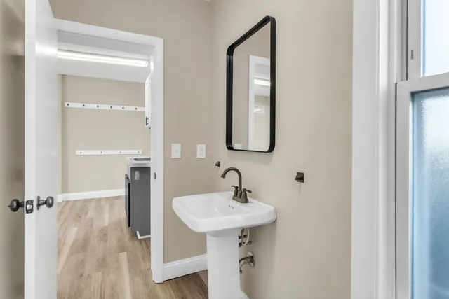 a bathroom with a sink and a mirror