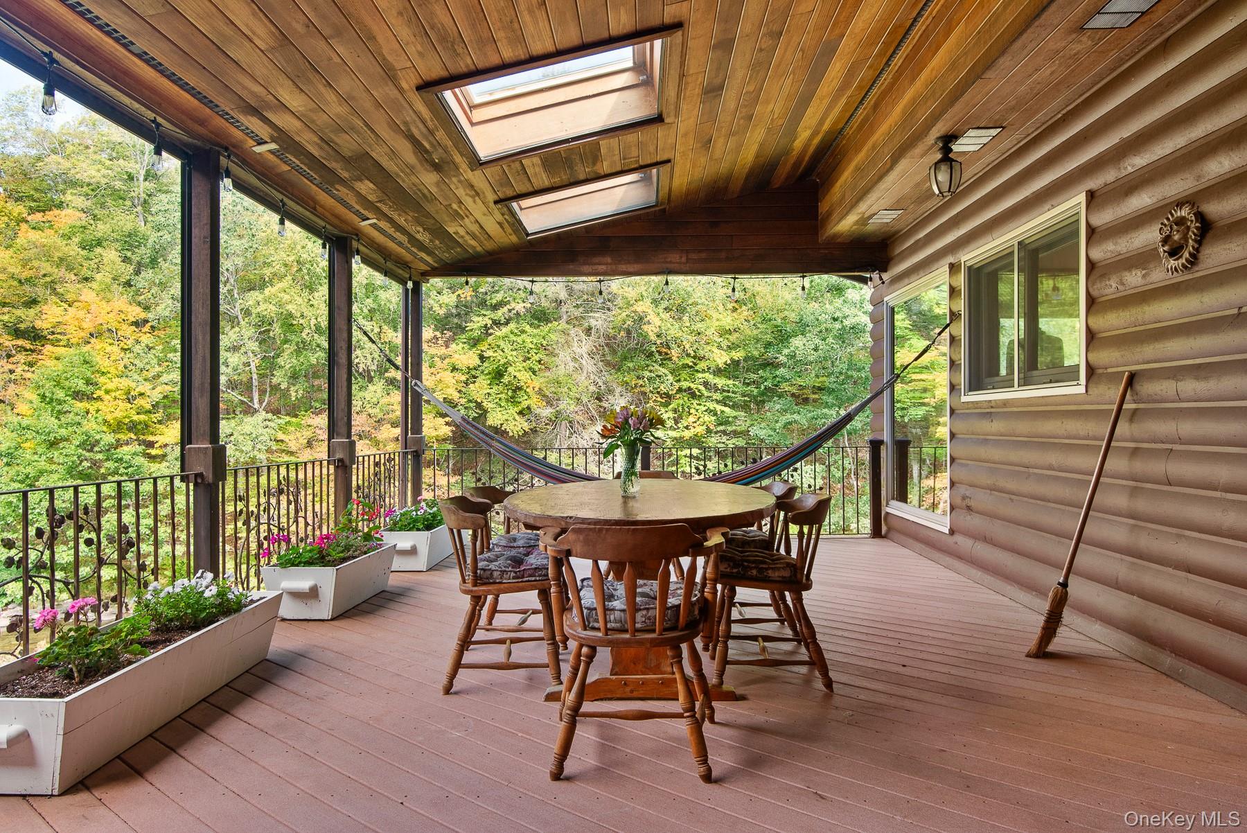 1009 Beaverkill Road Livingston Manor, NY 12758 - Photo 11 of 19 a dining room with furniture window and wooden floor
