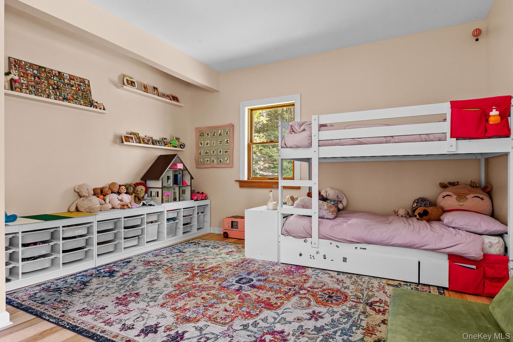 1009 Beaverkill Road Livingston Manor, NY 12758 - Photo 16 of 19 a bedroom with furniture and a wooden floor