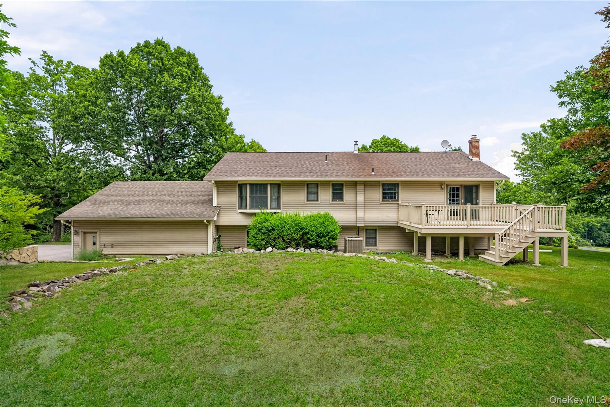 318 Beattie Road Washingtonville, NY 10992 - Photo 27 of 42 a front view of a house with a garden