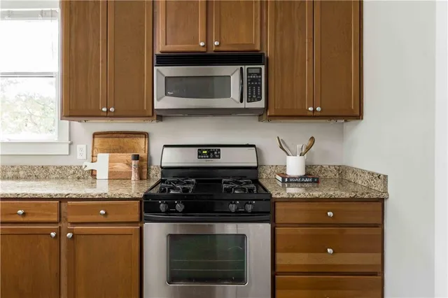 a living room with couch and a large window