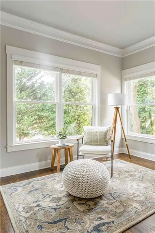 a view of a dining room with furniture and window
