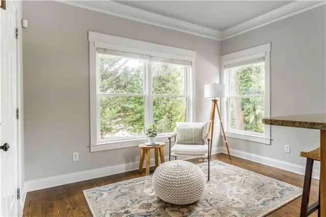 a view of a dining room with furniture and window