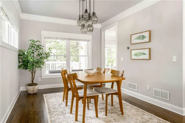 a balcony with wooden floor and furniture
