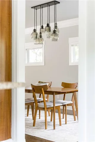 a balcony with wooden floor and outdoor seating