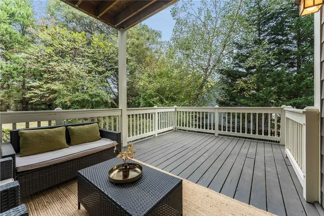 a room with a clock on wall and a window