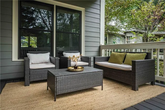 a view of a room with wooden floor and a window