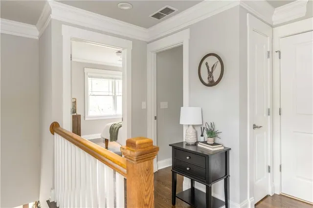a view of a livingroom with wooden floor and a window