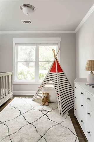 a spacious bedroom with a bed and window