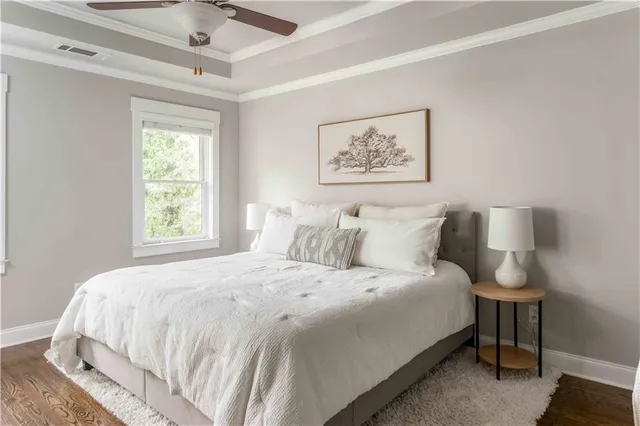 a bathroom with a granite countertop bathtub shower sink and vanity