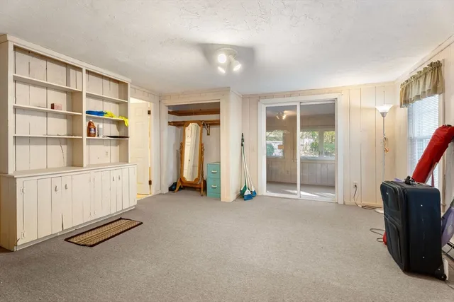 a view of an empty room with glass door
