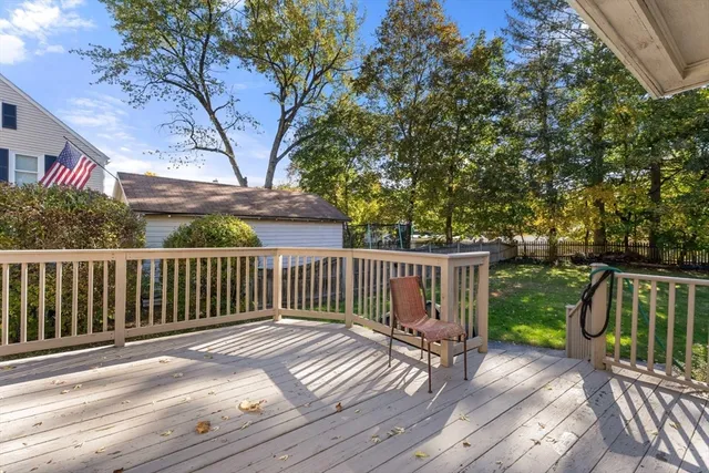 a view of balcony with wooden floor and fence