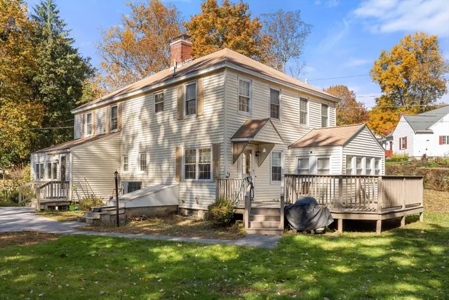 a view of a house with a yard