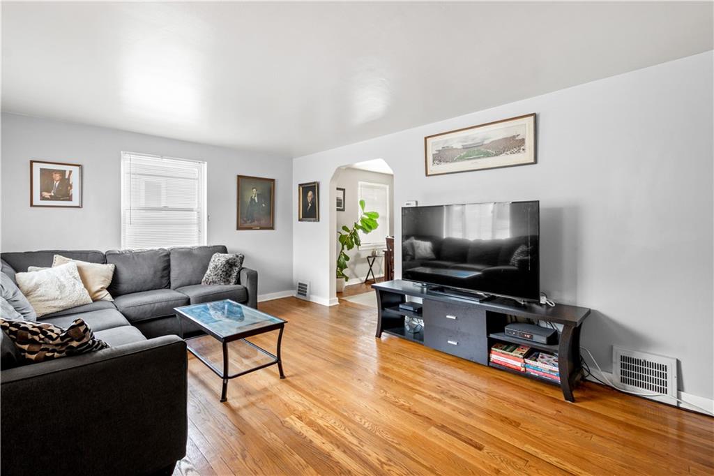 370 Vanadium Road Pittsburgh, PA 15243 - Photo 3 of 24 a living room with furniture and a flat screen tv