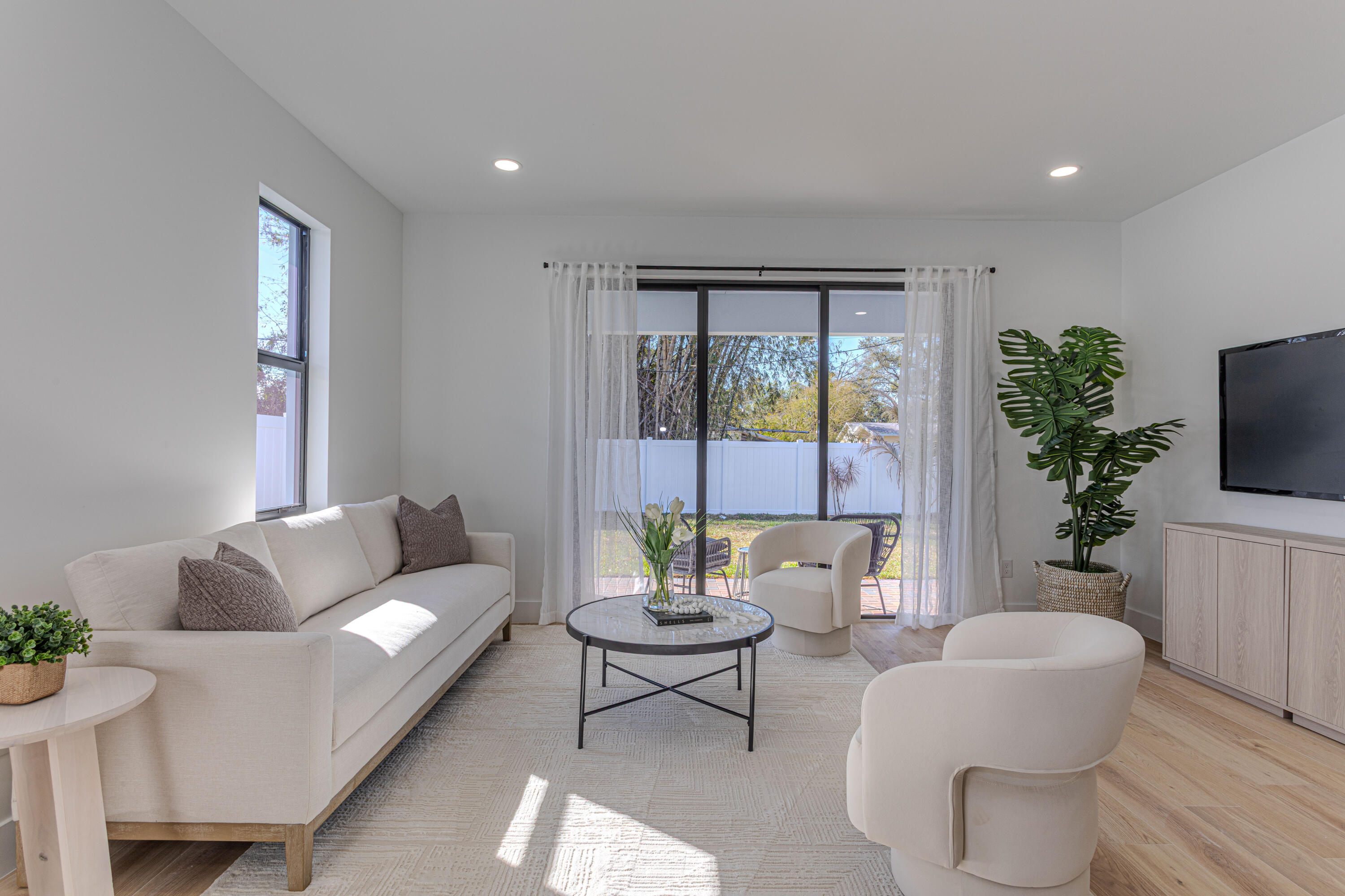 314 4th Street Jupiter, FL 33458 - Photo 11 of 55 a living room with furniture and a potted plant