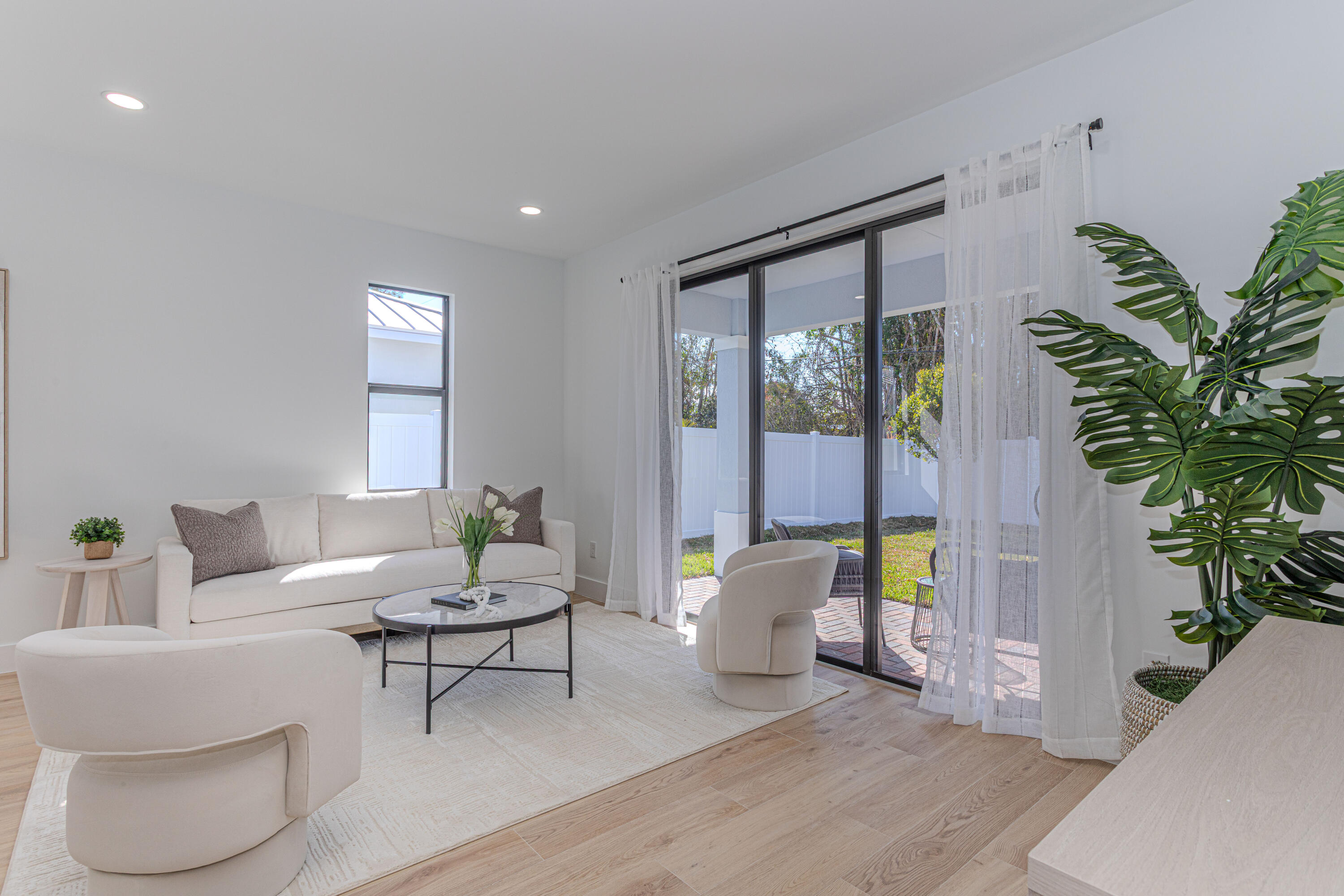 314 4th Street Jupiter, FL 33458 - Photo 12 of 55 a living room with furniture and a potted plant