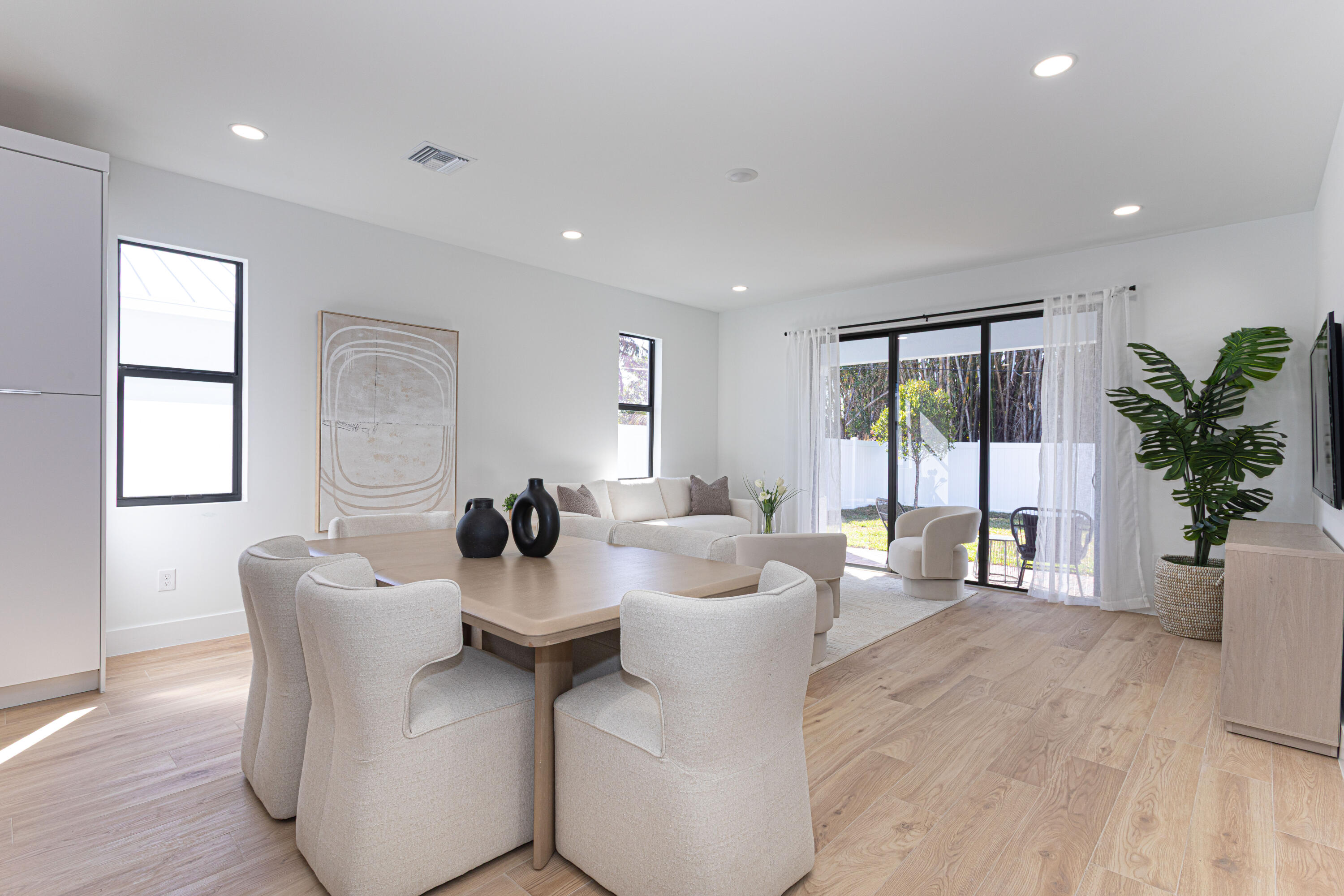 314 4th Street Jupiter, FL 33458 - Photo 15 of 55 a dining room with furniture a potted plant and a window