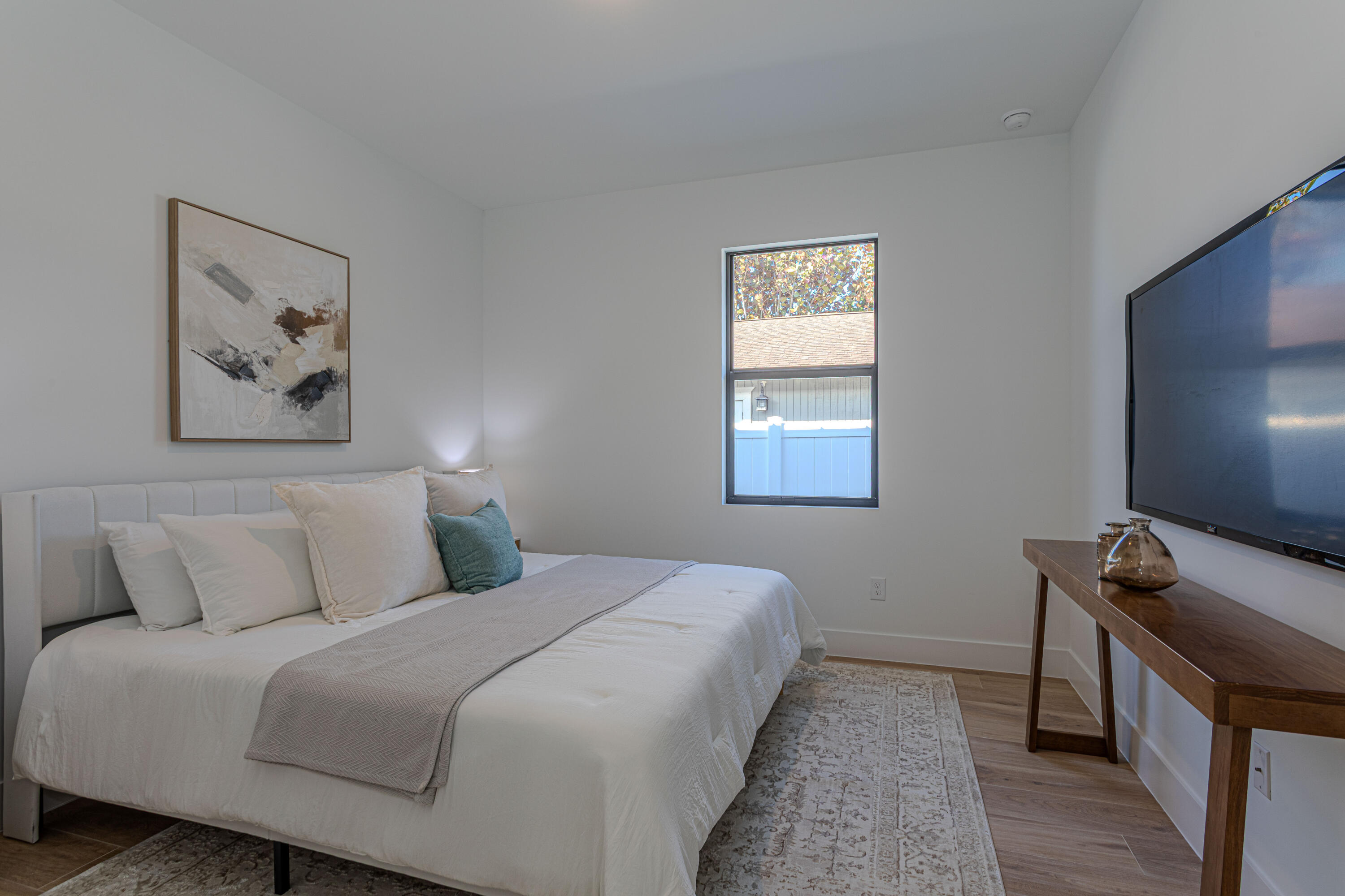 314 4th Street Jupiter, FL 33458 - Photo 27 of 55 a bedroom with a bed and a flat screen tv