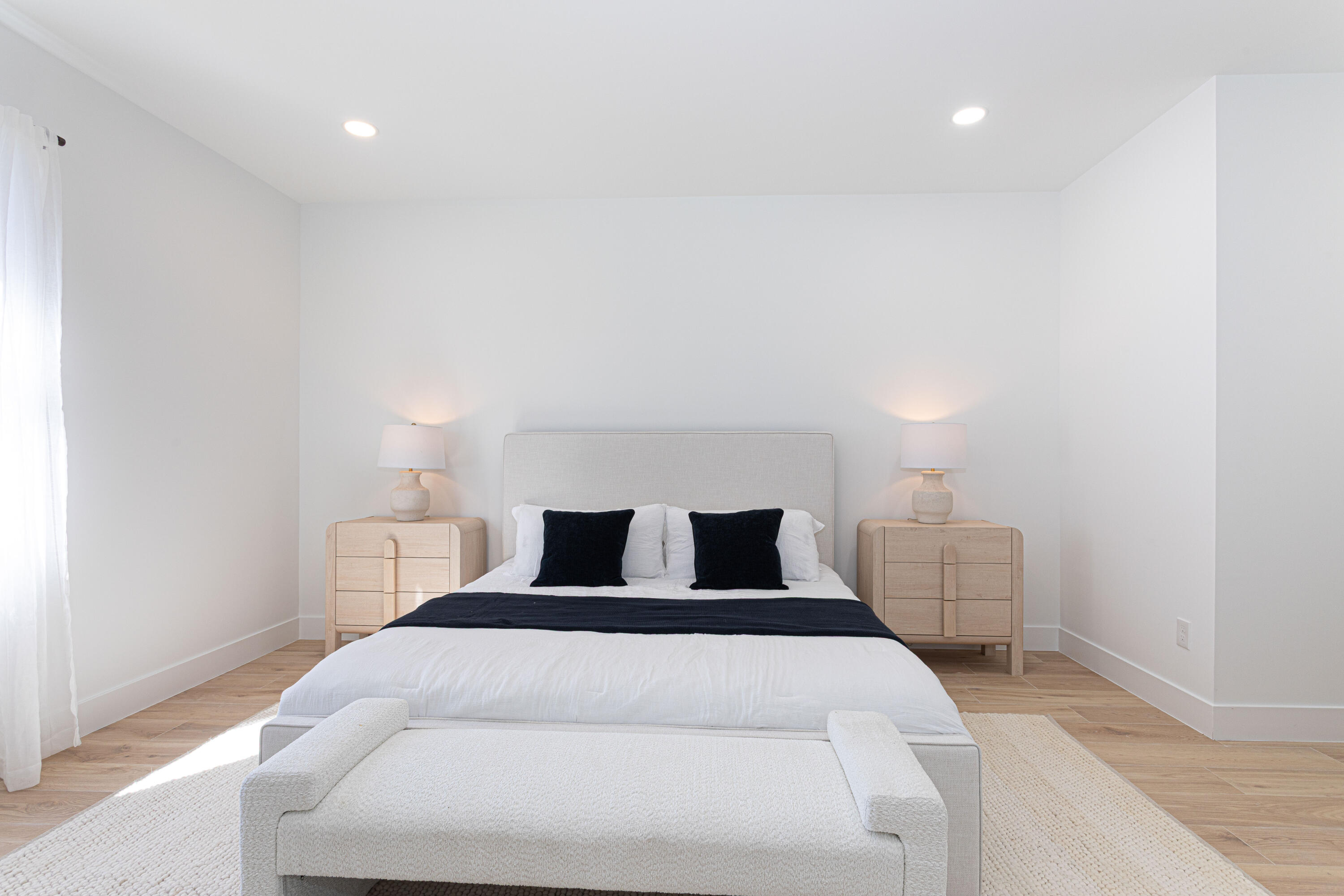 314 4th Street Jupiter, FL 33458 - Photo 29 of 55 a large bedroom with a bed and a lamp with window