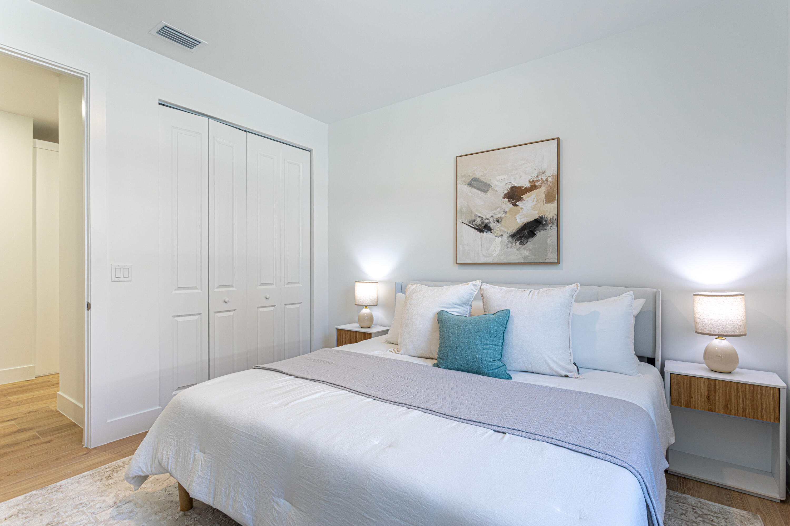 314 4th Street Jupiter, FL 33458 - Photo 30 of 55 a bedroom with a bed and a painting