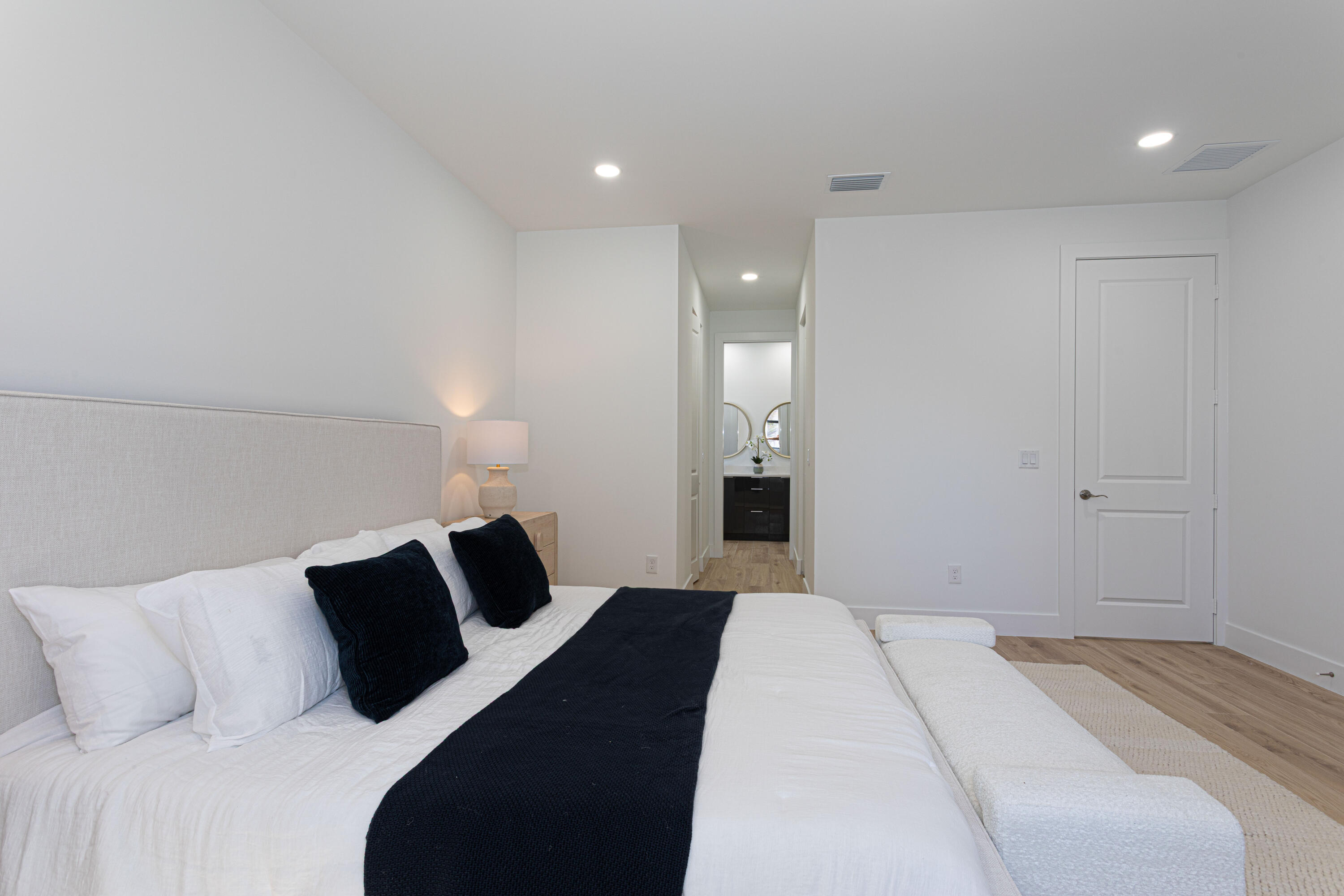 314 4th Street Jupiter, FL 33458 - Photo 31 of 55 a bedroom with a bed and a lamp