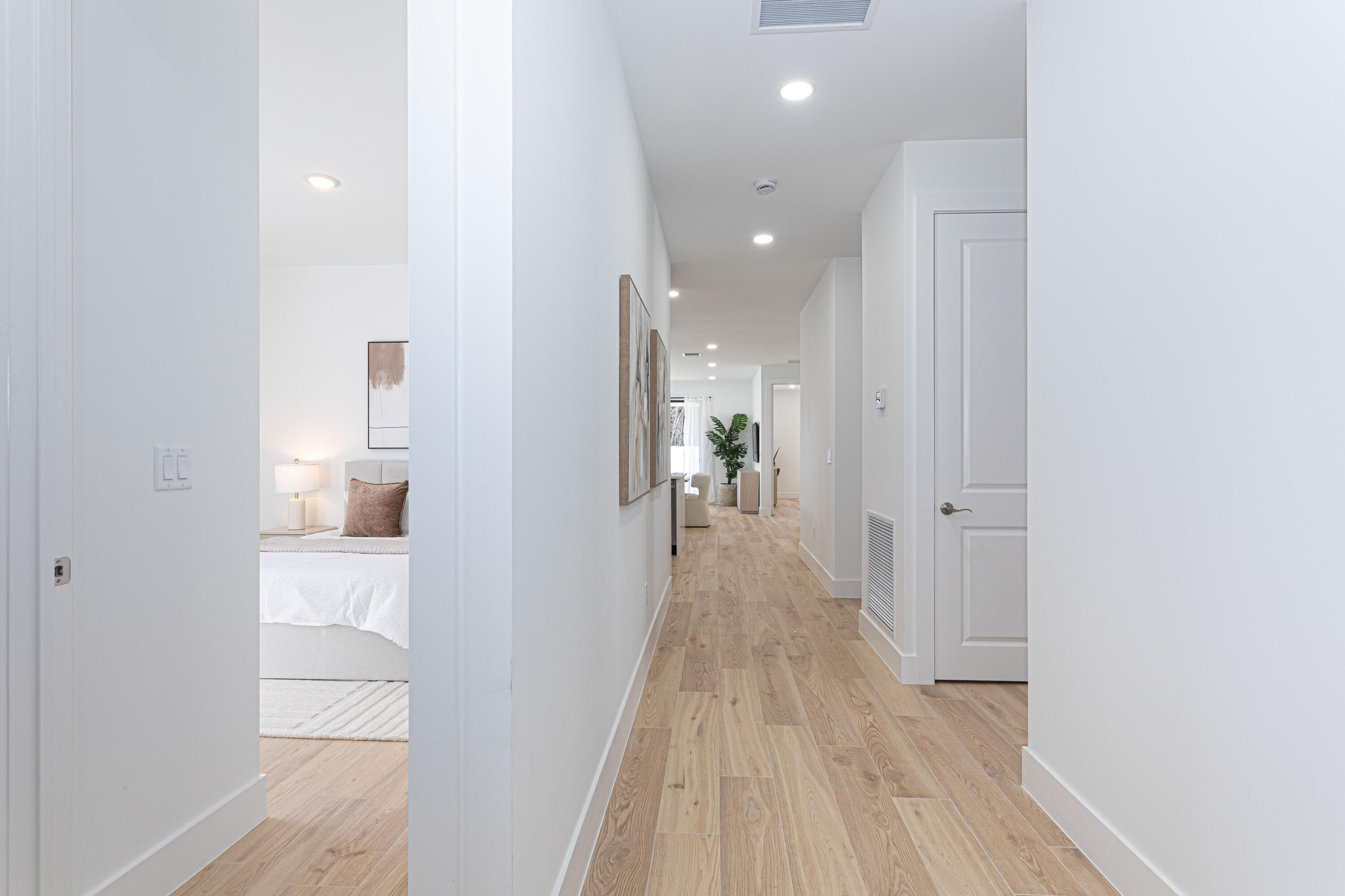 314 4th Street Jupiter, FL 33458 - Photo 33 of 55 a view of a hallway with wooden floor and a bathroom