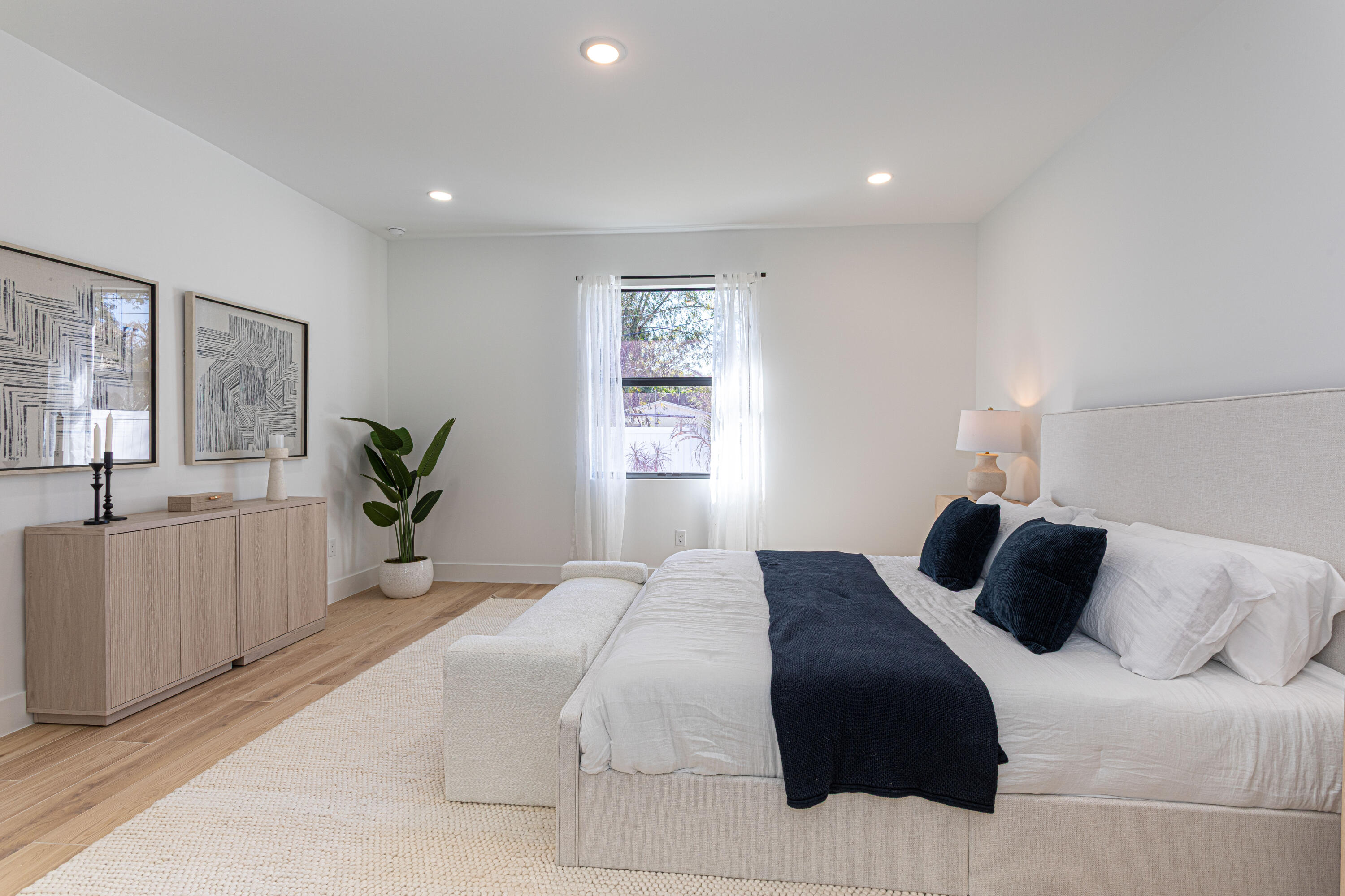 314 4th Street Jupiter, FL 33458 - Photo 41 of 55 a bedroom with a bed and a window