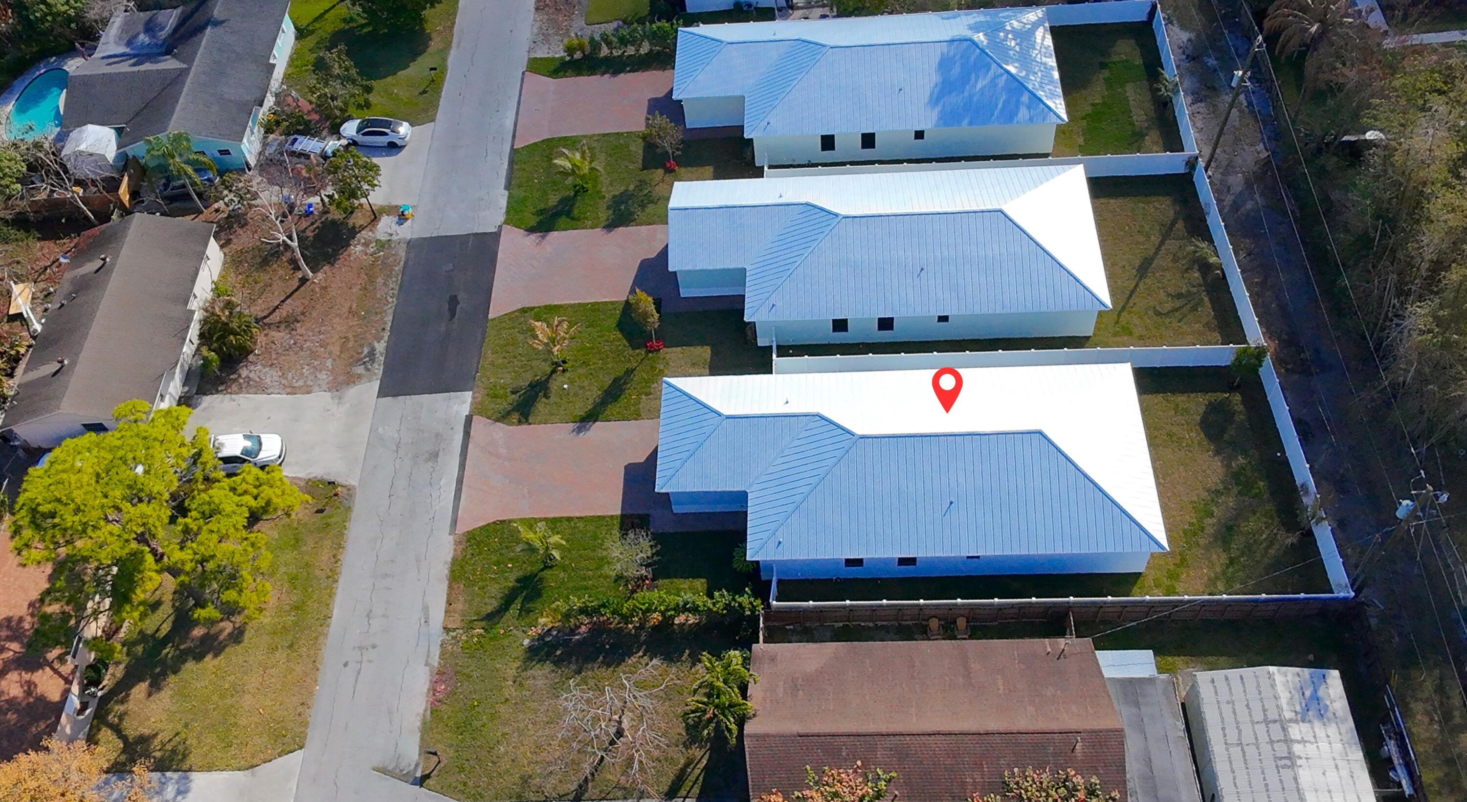 314 4th Street Jupiter, FL 33458 - Photo 48 of 55 an aerial view of a house with a yard