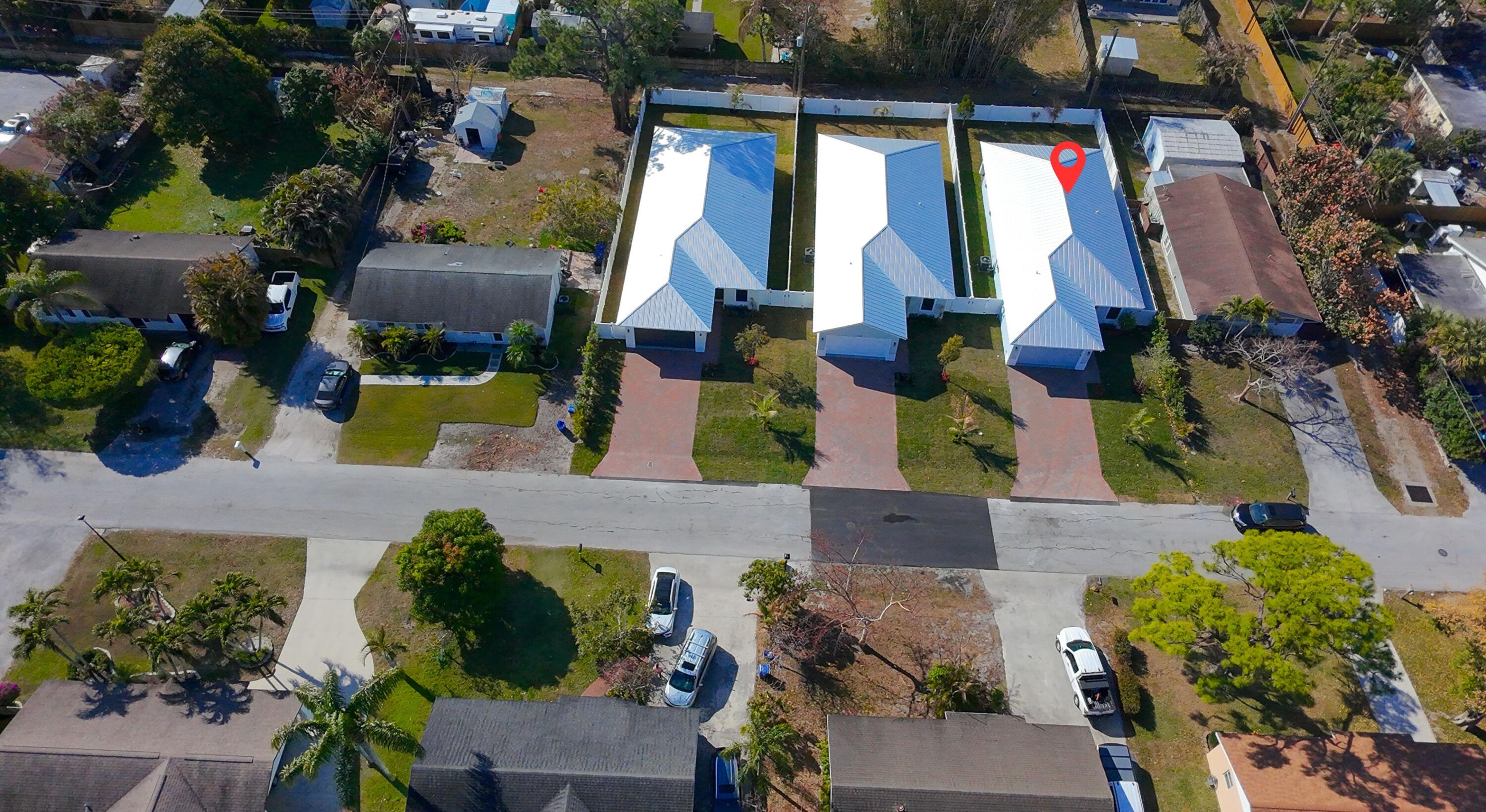 314 4th Street Jupiter, FL 33458 - Photo 49 of 55 an aerial view of houses with yard