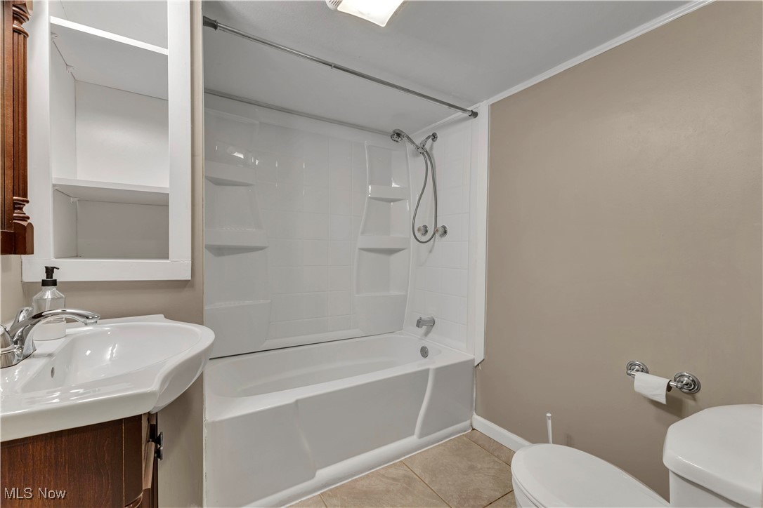 15388 Ridge Road North Royalton, OH 44133 - Photo 24 of 45 Bathroom with shower / washtub combination, tile patterned flooring, and vanity