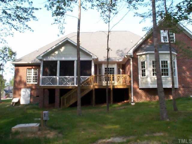 4200 Cypress Ridge Court Raleigh, NC 27616 - Photo 2 of 10 a backyard of a house with table and chairs