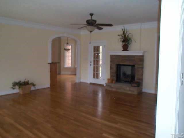 4200 Cypress Ridge Court Raleigh, NC 27616 - Photo 4 of 10 a view of empty room with wooden floor and fireplace