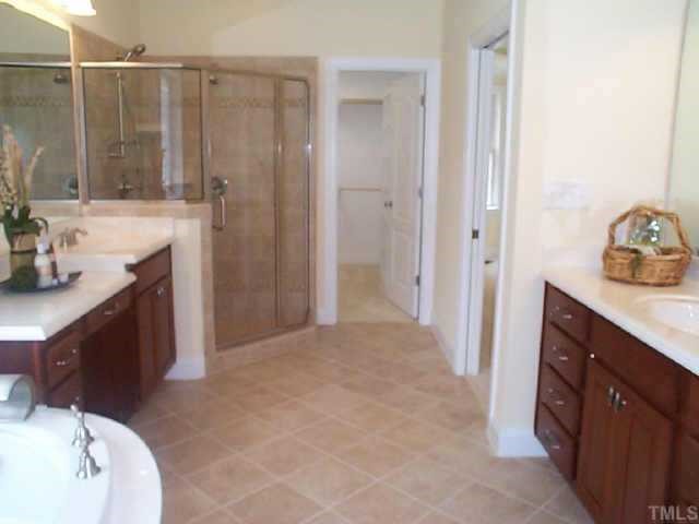 4200 Cypress Ridge Court Raleigh, NC 27616 - Photo 7 of 10 a bathroom with a sink vanity granite tub and shower