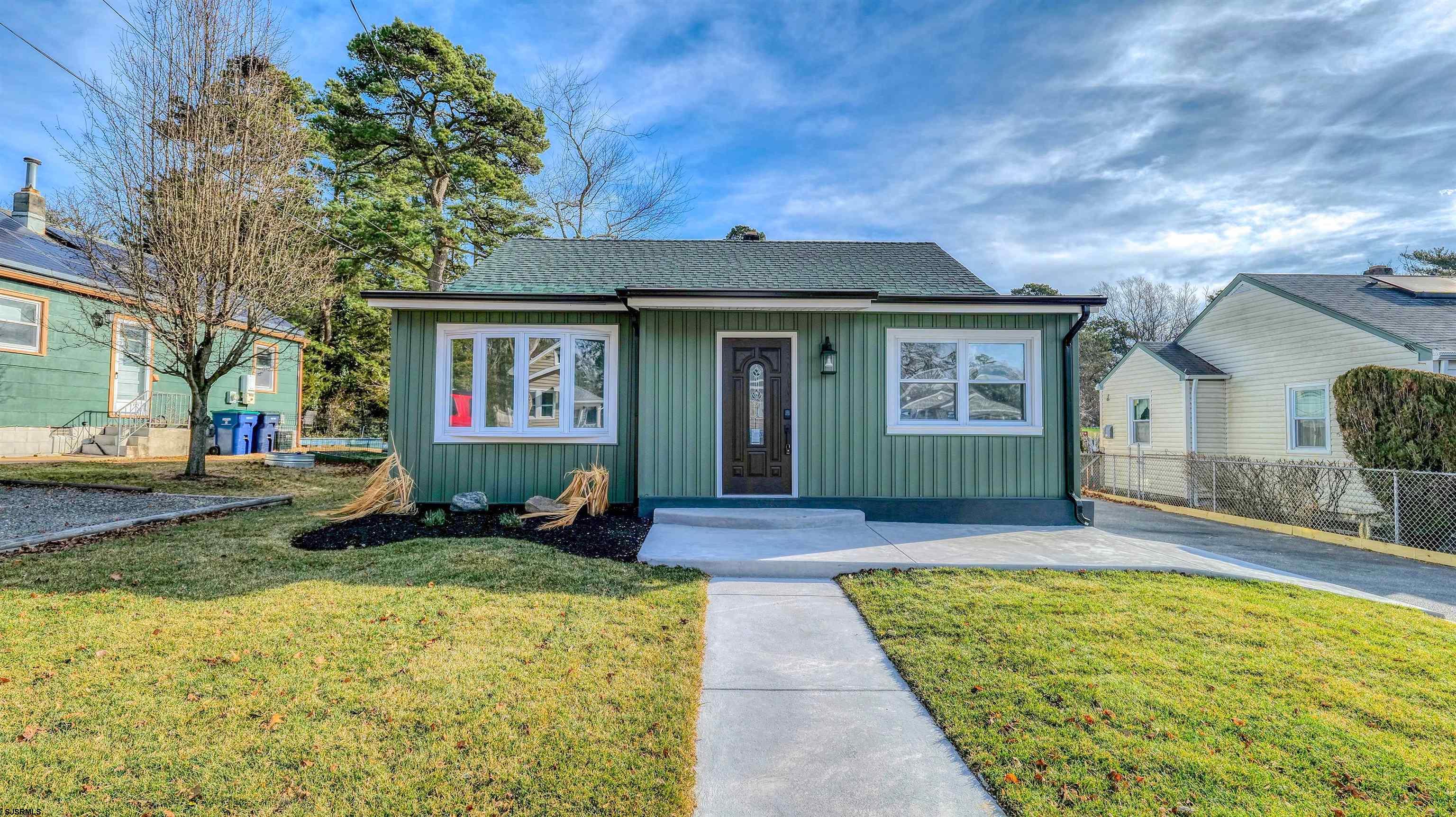 130 Davis Avenue Absecon, NJ 08201 - Photo 2 of 38 a front view of a house with garden