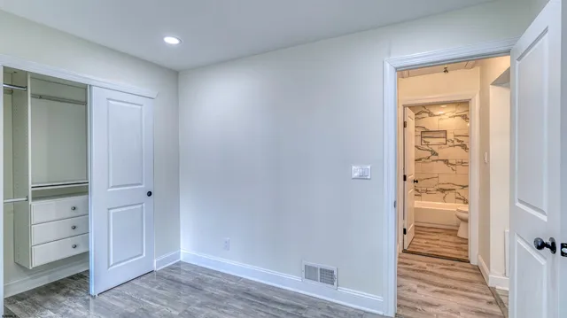 a bathroom with a bathtub and shower