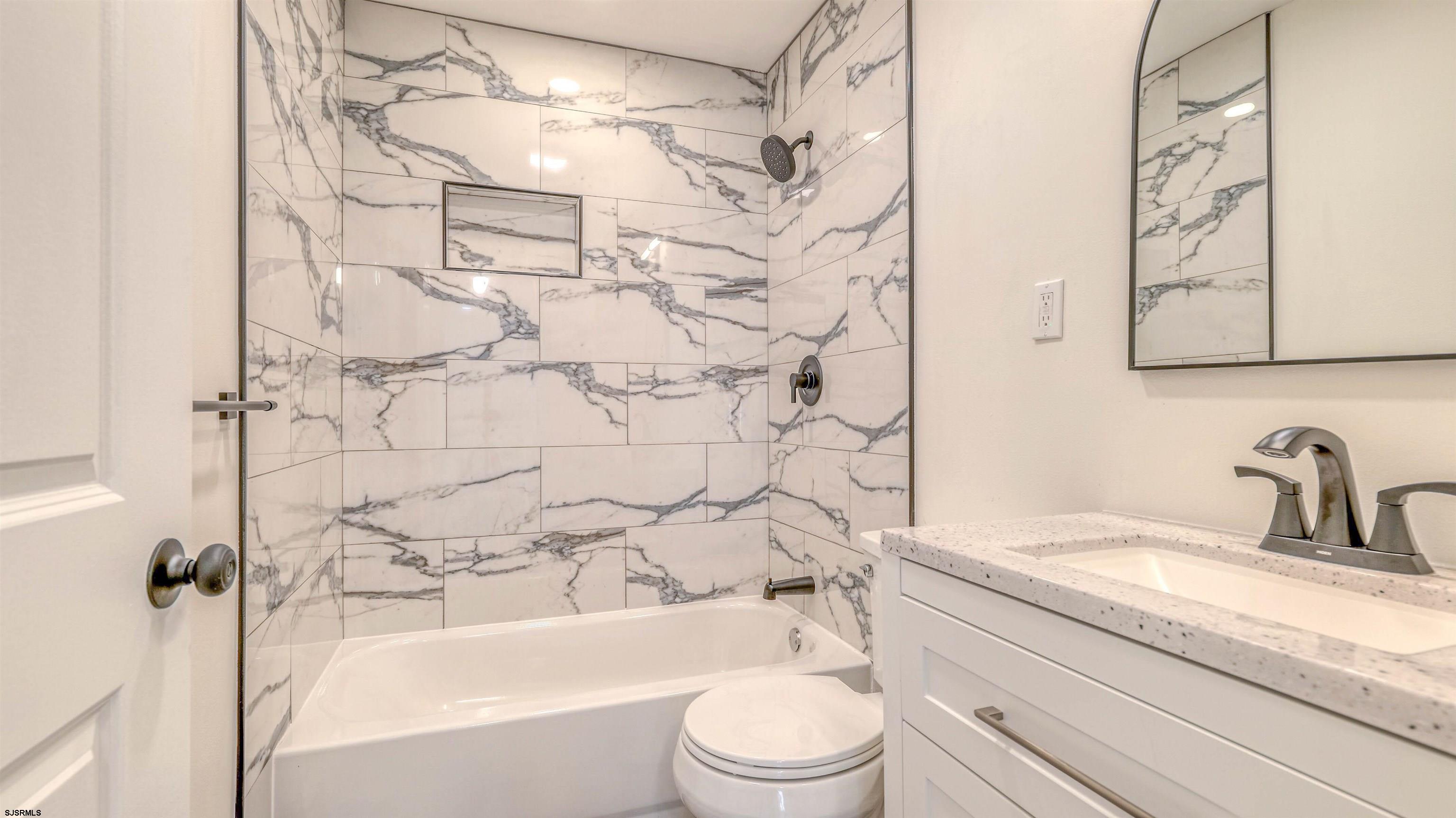 130 Davis Avenue Absecon, NJ 08201 - Photo 28 of 38 a bathroom with a granite countertop sink toilet and shower