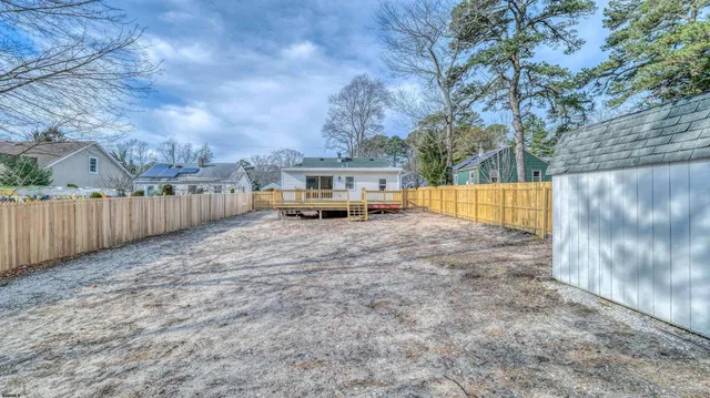 a view of backyard and tree