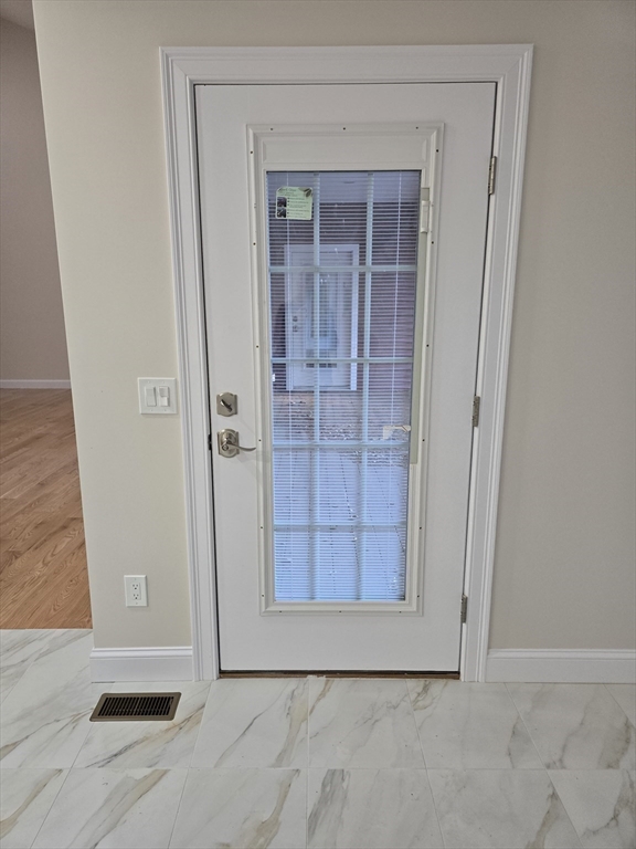 73 Dudley Hill Road Dudley, MA 01571 - Photo 21 of 33 an empty room with wooden door