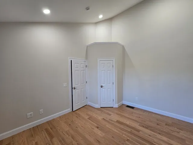 a view of a bathroom with mirror and window