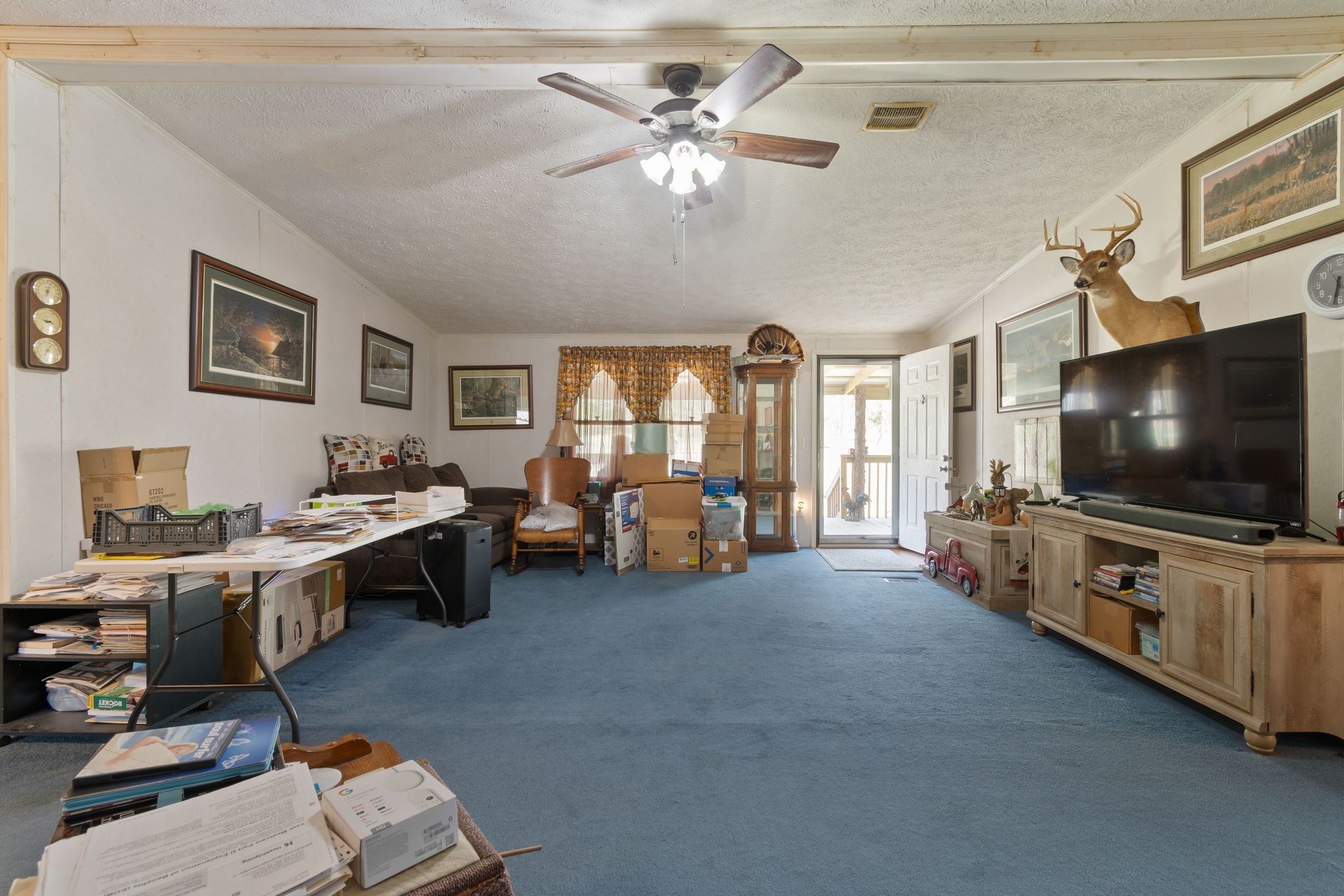 1300 New She Boss Road Duck River, TN 38454 - Photo 4 of 56 a living room with furniture and a flat screen tv