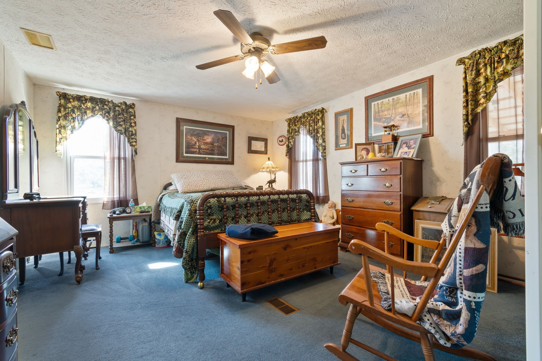 1300 New She Boss Road Duck River, TN 38454 - Photo 5 of 56 a bedroom with furniture and a large window